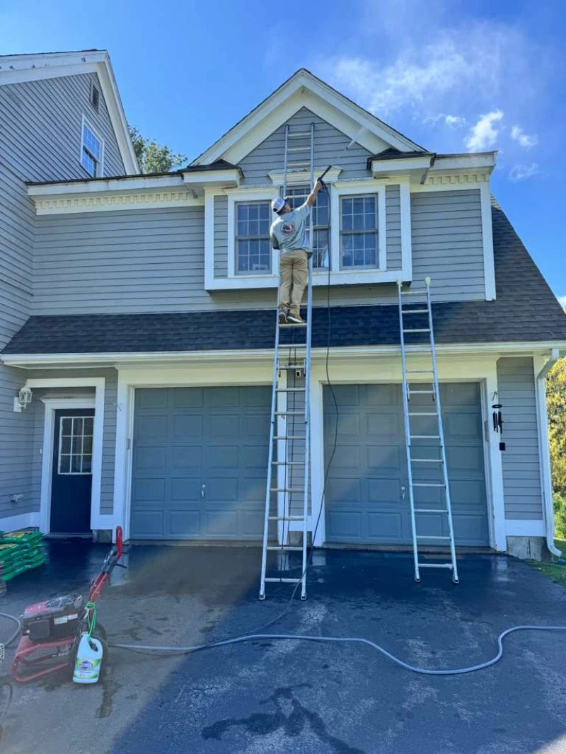 House Painting crew preparing a home for a fresh coat of paint
