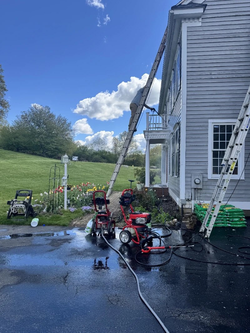 House Painting power washing setup with pressure equipment at a home